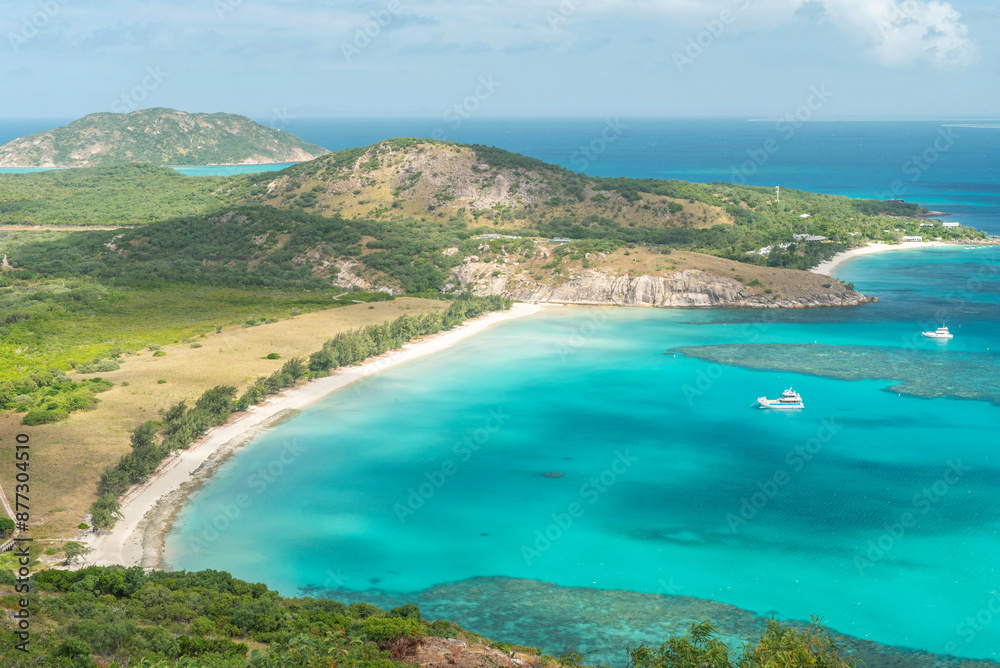 Picturesque tropical sandy Watsons Beach with turquoise water on Lizard Island, Australia. Lizard Island is located on Great Barrier Reef in north-east part of Queensland.
