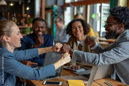 Unity, teamwork, successful partnership and collaboration concept. People of diverce race business colleagues performing fist bump