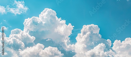 Fototapeta Naklejka Na Ścianę i Meble -  Blue sky with white fluffy clouds ideal for a copy space image