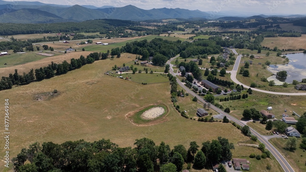 Peaceful landscape with Blue Ridge Mountains and farmland countryside with small town life Peaceful landscape with Blue Ridge Mountains and farmland countryside with small town life
