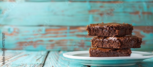 Wallpaper Mural Brownie and cake on a white plate against a turquoise wooden backdrop with room for copy space image Torontodigital.ca