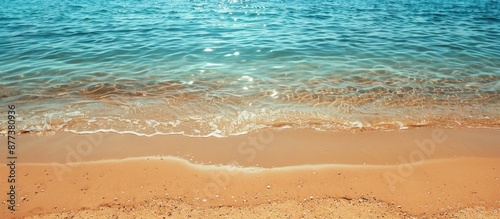 Fototapeta Naklejka Na Ścianę i Meble -  Sandy beach on the Mediterranean coast with empty clear sand providing a summer background and space for copy in the image