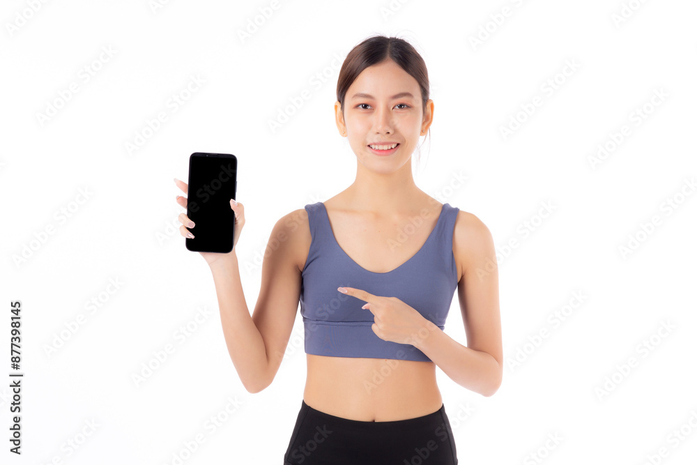 Young asian woman in sportswear workout holding and presenting blank screen smartphone isolated white background, girl in sportswear showing mockup smart phone, sport and health care concept. Young asian woman in sportswear workout holding and presenting blank screen smartphone isolated white background, girl in sportswear showing mockup smart phone, sport and health care concept.