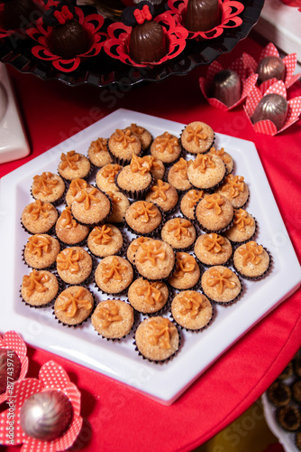 Brigadier. Chocolate covered party sweet. Plate with various sweets, typical Brazilian food