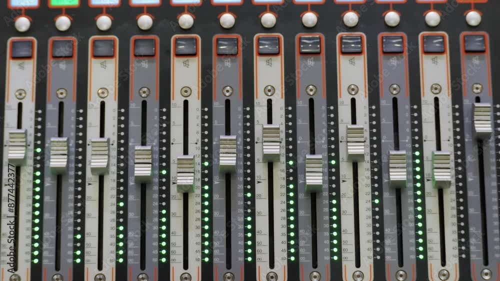 Soundboard pads station close-up. Sound designer use digital audio mixer in production studio. Sound engineer sliders in radio station. Engineer press key buttons control desk recording TV studio