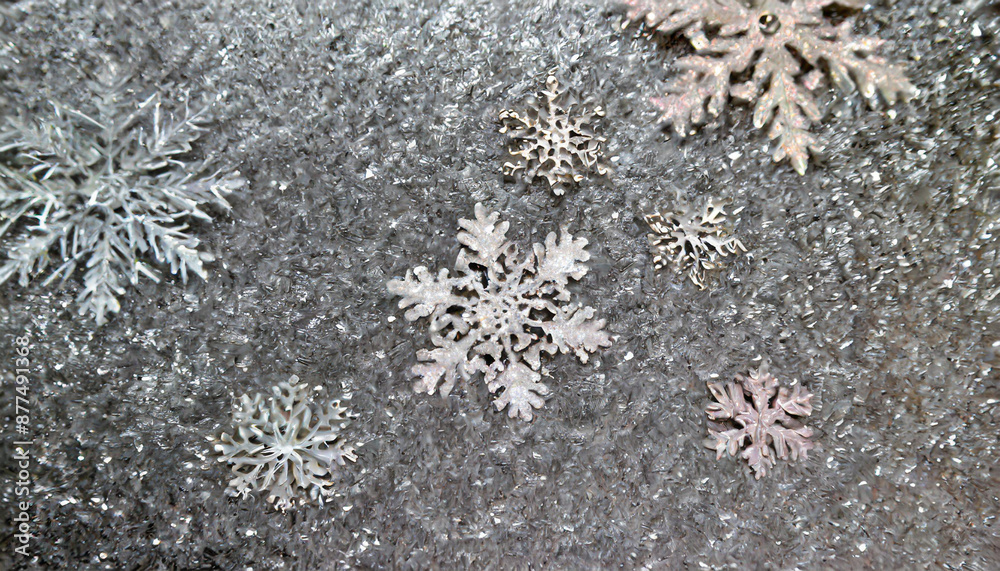 on a metallic rough background lie snowflakes winter time texture and snow on a metallic rough background lie snowflakes winter time texture and snow