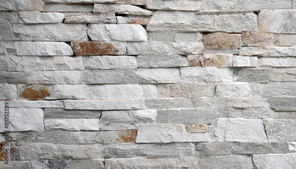 Stone wall texture background - grey stone siding with different sized stones Stone wall texture background - grey stone siding with different sized stones