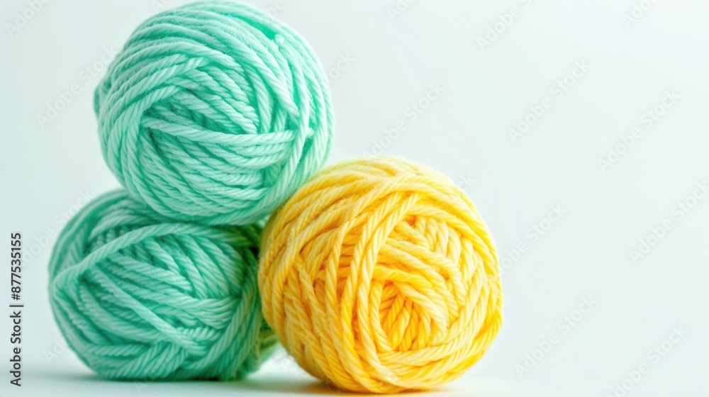 Acrylic yarn in mint and yellow on white background for baby knitting projects Ideal for children s store flyers banners website Acrylic yarn in mint and yellow on white background for baby knitting projects Ideal for children s store flyers banners website