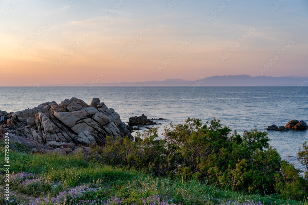 Sardinia coast at sunset with corsica island on the background Sardinia coast at sunset with corsica island on the background