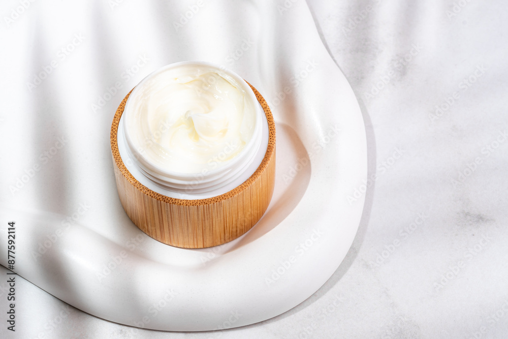 Face cream moisturizer in a jar on concrete background, luxury skincare cosmetics and anti-aging product for healthy skin and beauty routine. Top view Face cream moisturizer in a jar on concrete background, luxury skincare cosmetics and anti-aging product for healthy skin and beauty routine. Top view