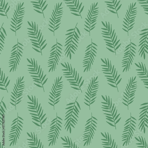 Seamless vector pattern with palm leaves. Background pattern with palm leaves. Designer wallpaper made of tropical leaves. Botanical texture design for prints, wall paintings and wallpapers. © Nadezhda