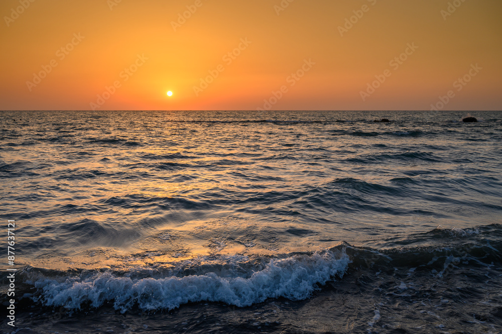 Obraz premium Bright sun at sunset. Mediterranean Sea