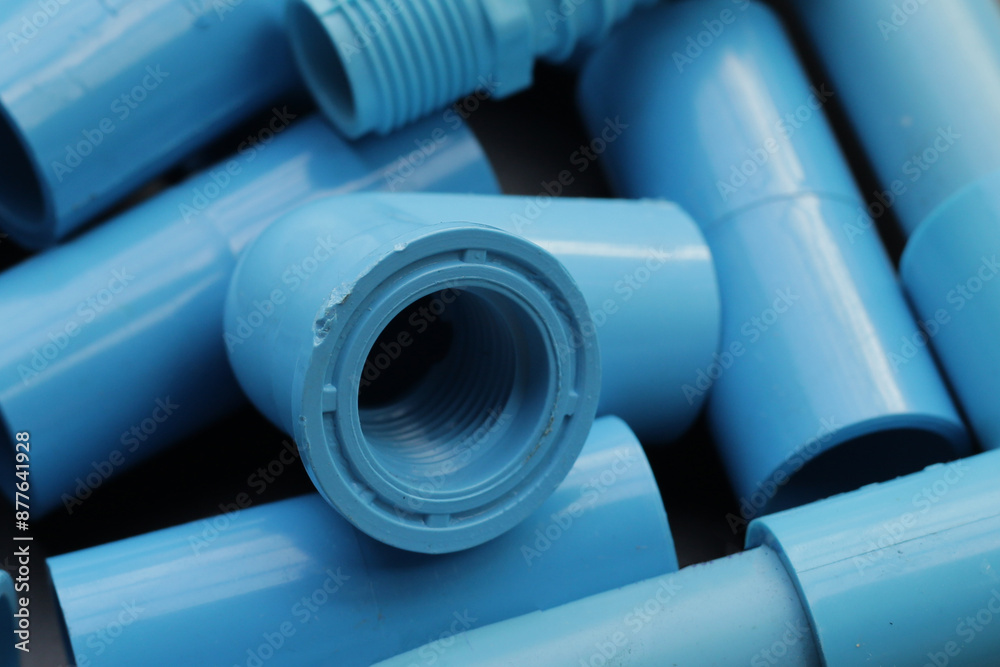 Fototapeta premium Plumber equipment with blue pvc pipe connections for plumbing work.