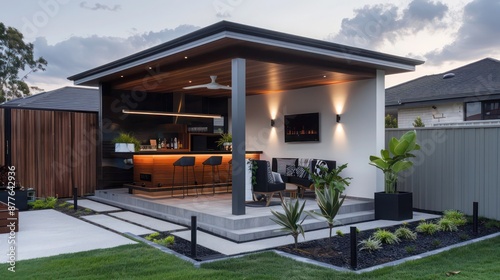 contemporary suburban home with a focus on outdoor living, featuring a modern gazebo with an integrated bar and entertainment system © Ramzan