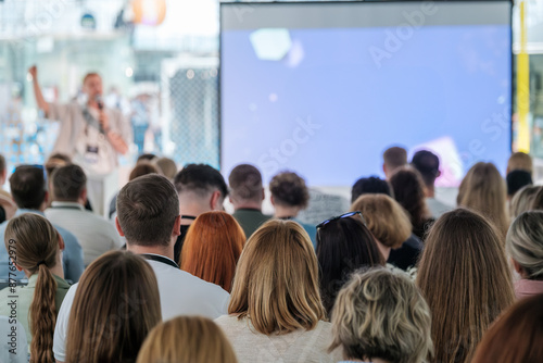 Wallpaper Mural Speaker addresses a diverse audience at a professional conference or seminar, with a focus on engaging the listeners. Torontodigital.ca