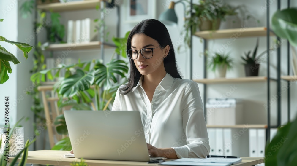 Fototapeta premium The woman at office desk