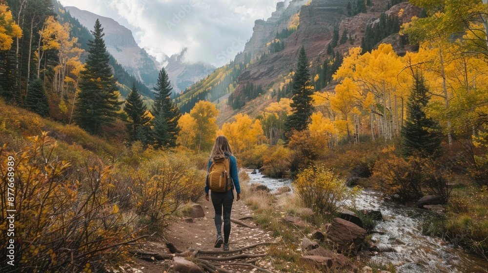 A woman trekking in the Uncompahgre National Forest near Ouray, Colorado's Bear Creek National Recreation Trail. A woman trekking in the Uncompahgre National Forest near Ouray, Colorado's Bear Creek National Recreation Trail.