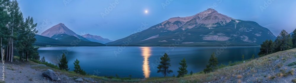 Fototapeta premium mountain range with a lake and a full moon