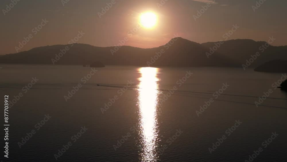 island sun's rays reflect in the ocean at sunrise. Beautiful aerial view drone island sun's rays reflect in the ocean at sunrise. Beautiful aerial view drone
