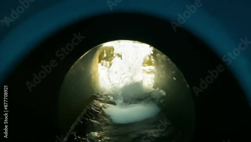 POV being flushed down the toilet and emerging into a drone shot of a beautiful estuary at sunset.
