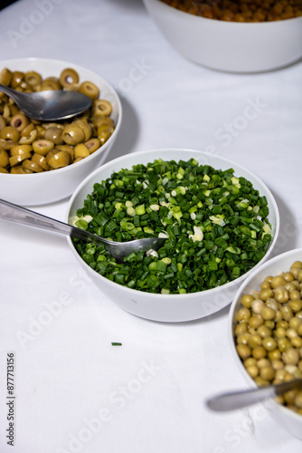 Onion. Chopped green onion, food served on plate, photograph of vegetables on table