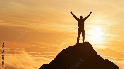 A man is standing on top of a mountain, with the sun setting behind him © top images