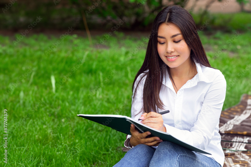 Fototapeta premium Asian student girl studying, taking notes in campus, preparing for lecture