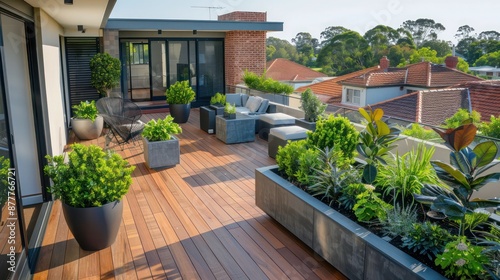 Craftsman-style rooftop terrace with wooden flooring and planters, creating a green oasis above the suburb © Ramzan