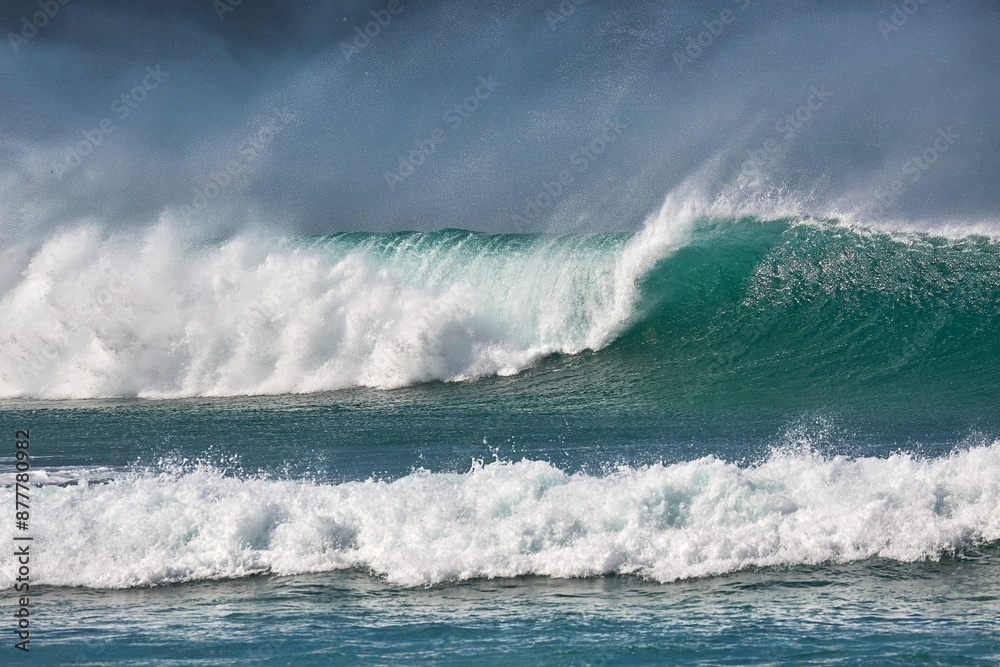 Fototapeta premium Stormy Waves Breaking Near The Sea Shore