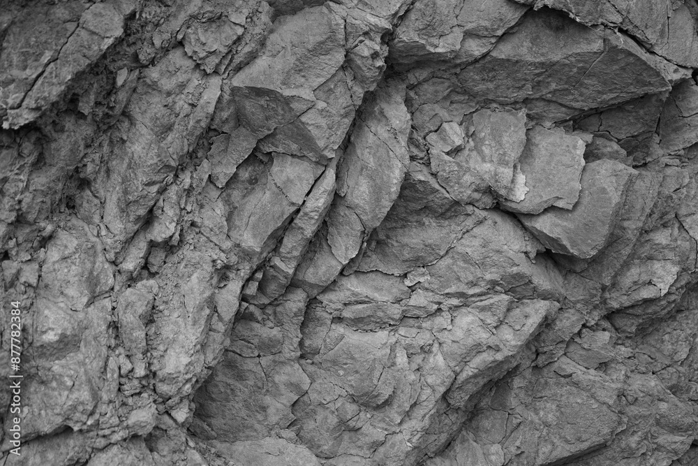 Black white light gray rock stone basalt mountain granite volcanic texture background. Close-up. 3d. Cracked collapse, broken, crumbled.