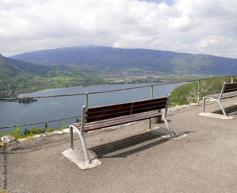 Obraz premium wooden bench with view over semnoz and Annecy lake in Haute savoie, France