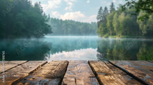 A rustic wooden dock overlooking a calm lake surrounded by lush forest, creating a peaceful and natural retreat.