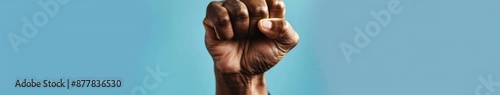 Abstract powerful image of a clenched fist with voice raised, symbolizing solidarity and resistance in the face of injustice photo