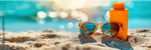 Beachside Bliss: Sunscreen and Sunglasses on a Sandy Backdrop, Essential Gear for a Sun-Kissed Day by the Sea photo