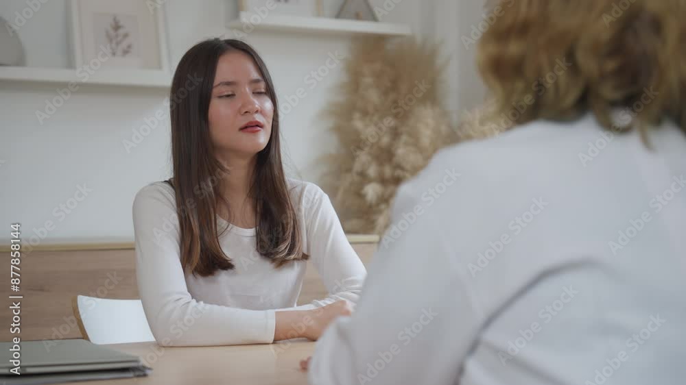 Teen Girl Giving Interview to Social Worker or Psychologist During Counseling Session for Depression and Therapy Teen Girl Giving Interview to Social Worker or Psychologist During Counseling Session for Depression and Therapy