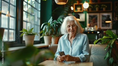 The elderly woman with smartphone photo