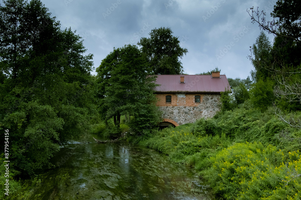 Old brick mill with a view on river in Mazury Poland Old brick mill with a view on river in Mazury Poland
