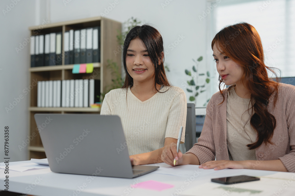 Group of young women excited about Asian business team creating office colleagues Glad to be a successful partner in teamwork celebrating success and startup business idea. Group of young women excited about Asian business team creating office colleagues Glad to be a successful partner in teamwork celebrating success and startup business idea.