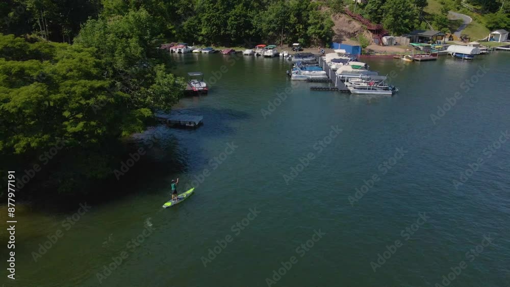 Woman Rides Paddle Board Alone on Lake Woman Rides Paddle Board Alone on Lake