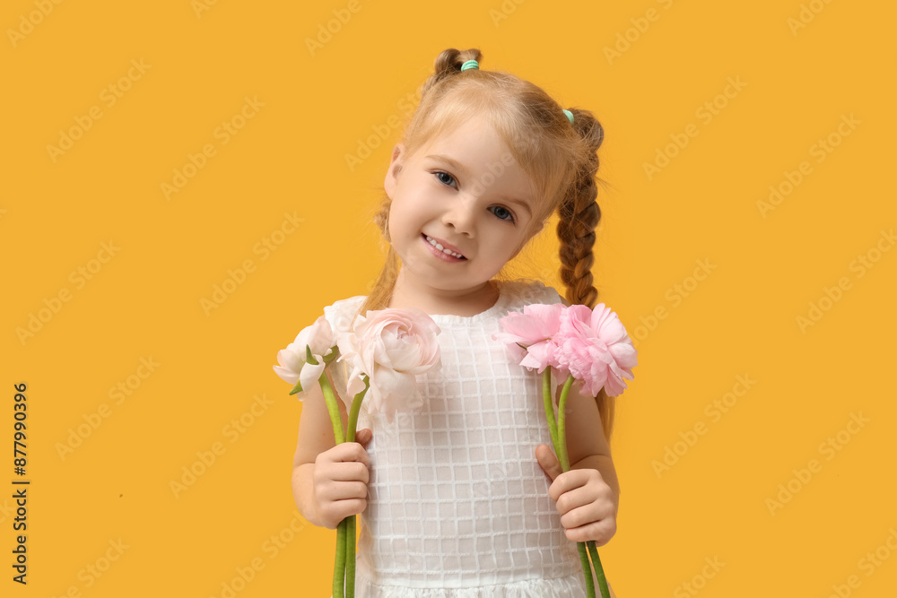 Cute little girl with beautiful ranunculus flowers on yellow background Cute little girl with beautiful ranunculus flowers on yellow background