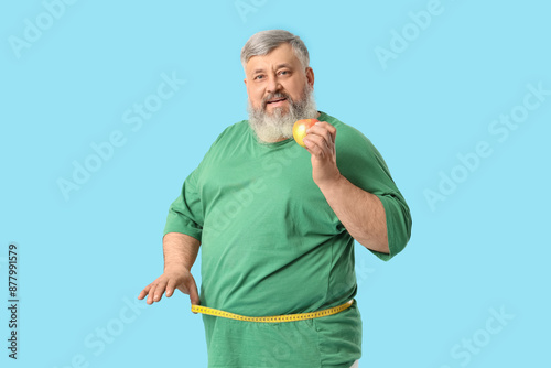 Overweight happy mature man...