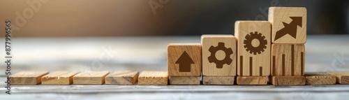 Wooden blocks with symbols stacked in a row, representing growth and success. photo