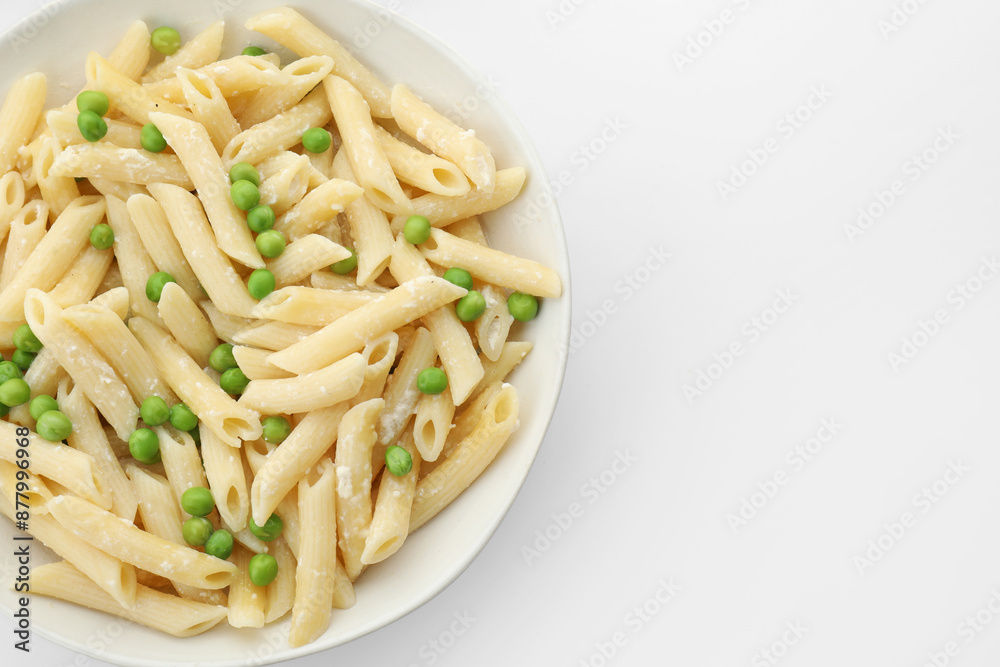 Delicious pasta with green peas and cheese in bowl on white background, top view. Space for text Delicious pasta with green peas and cheese in bowl on white background, top view. Space for text