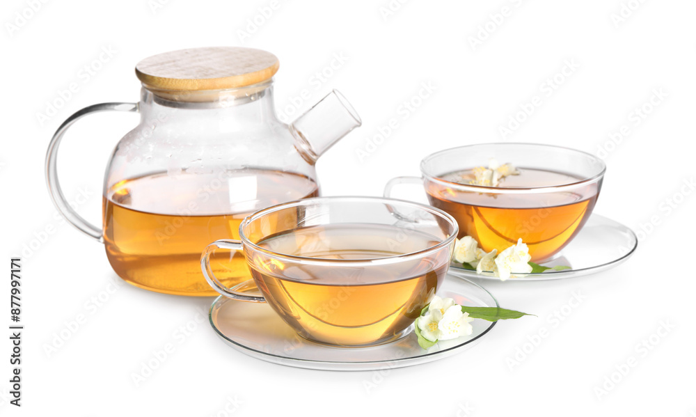 Aromatic jasmine tea in cups, flowers and teapot isolated on white Aromatic jasmine tea in cups, flowers and teapot isolated on white