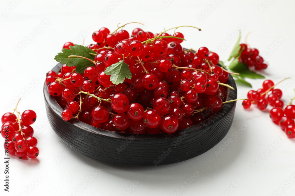 Fresh red currant berries on white table, closeup Fresh red currant berries on white table, closeup