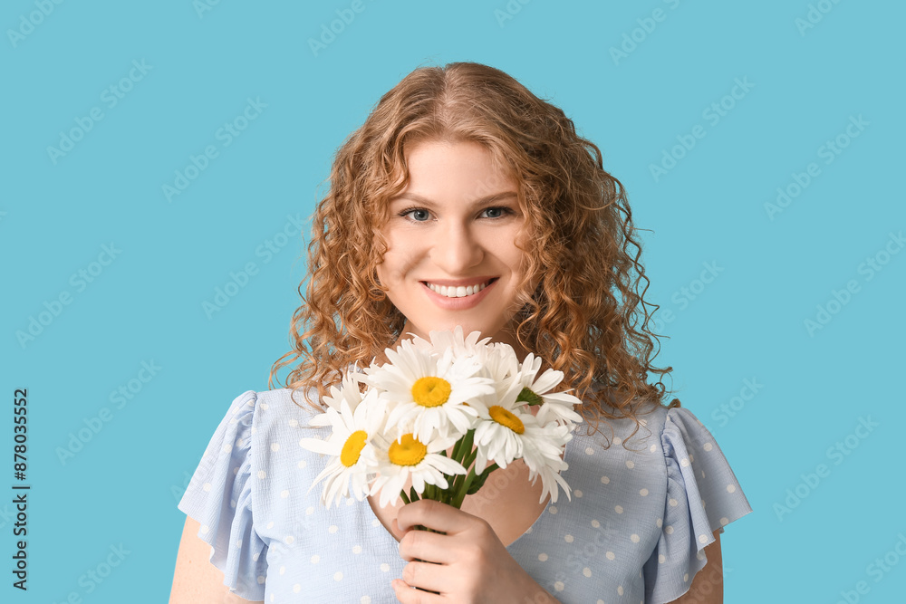 Happy young woman with bouquet of chamomile flowers on blue background Happy young woman with bouquet of chamomile flowers on blue background