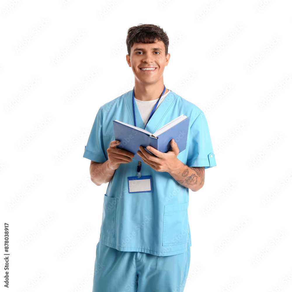 Male medical student with book and badge on white background