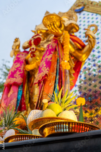 Offerings of melons, pomelo, and sugar cane that Buddhists bring to offer to the highly revered Lord Ganesha, enshrined at Bang Yai Temple, Nonthaburi, Thailand. photo