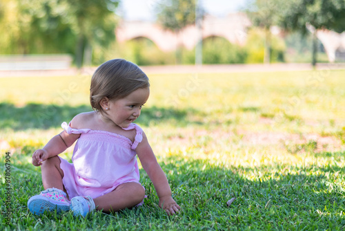 Baby Girl Exploring The Park On A Sunny Day