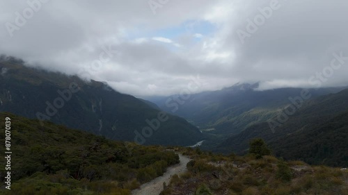 Wallpaper Mural Pov hike on key summit trail of mountains in Fiordland Nationalpark. Cloudy day with green scenery in New Zealand. Torontodigital.ca